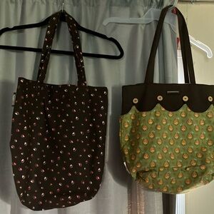2 Longaberger totes. One animal paw print with one very deep pocket inside.